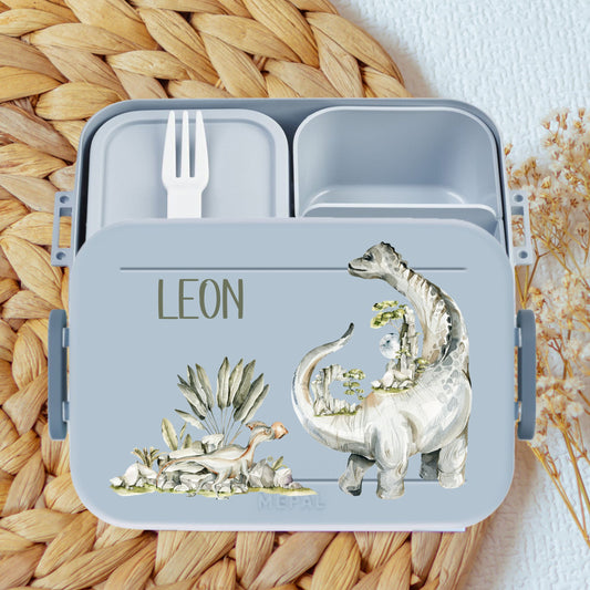 Lunchbox mit vielen Dinosaurier Motiven, Bento Einsatz und Namen in blau - hier gestalten